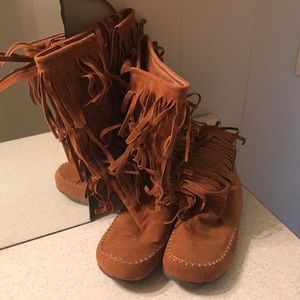Women’s cognac zip up fringe boots.